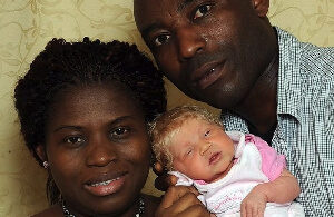 Black parents with a white baby